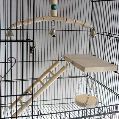 Wooden bird chew toy with a curved perch made of beads and cylinders, featuring three silver bells and a blue accent bead, hanging from a metal chain. - Image 4