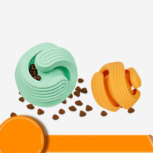 Two mint green pet dog toy balls with spiral grooves, designed for teeth cleaning and treat dispensing, filled with kibble.