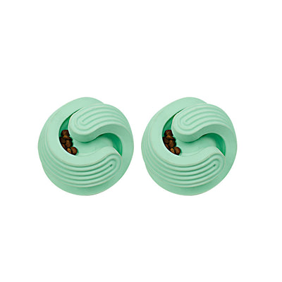 Two mint green pet dog toy balls with spiral grooves, designed for teeth cleaning and treat dispensing, filled with kibble. - Image 5
