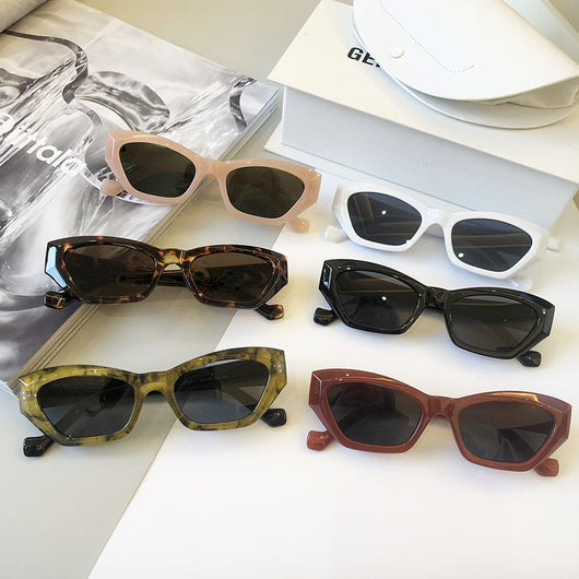Retro cat-eye sunglasses with a tortoiseshell frame and brown lenses, perfect for a fashionable look.