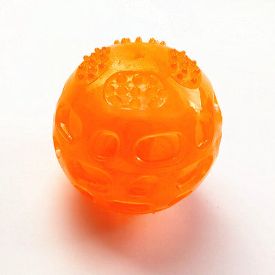 Translucent blue rubber dog toy ball with textured nubs and recessed areas for chewing and teeth cleaning. - Image 5