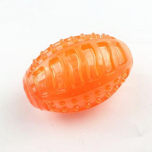 Translucent blue rubber dog toy ball with textured nubs and recessed areas for chewing and teeth cleaning. - Image 6