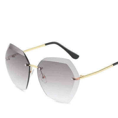 Women's rimless oversized sunglasses with gradient brown lenses and clear, purple, and blue rhinestone embellishments. - Image 18