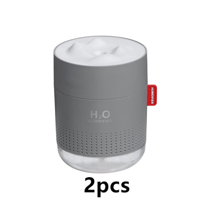 White cylindrical USB charging desktop humidifier with a clear base and a textured snow mountain top. Features 'H₂O HUMIDIFIER' text and a red tag. - Image 8