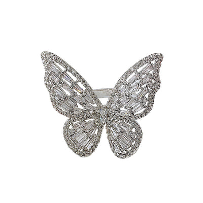 Sparkling silver-tone butterfly ring with clear baguette and round cut stones on a white surface. - Image 2