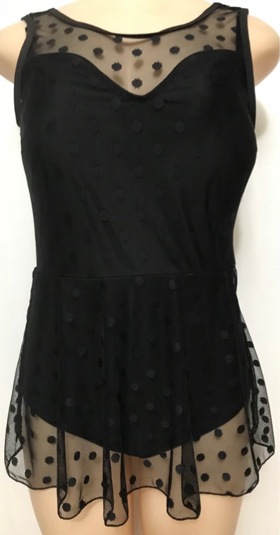 Plus size woman in a black one-piece swimsuit with a sheer mesh top and a short, polka-dot skirt overlay. - Image 8