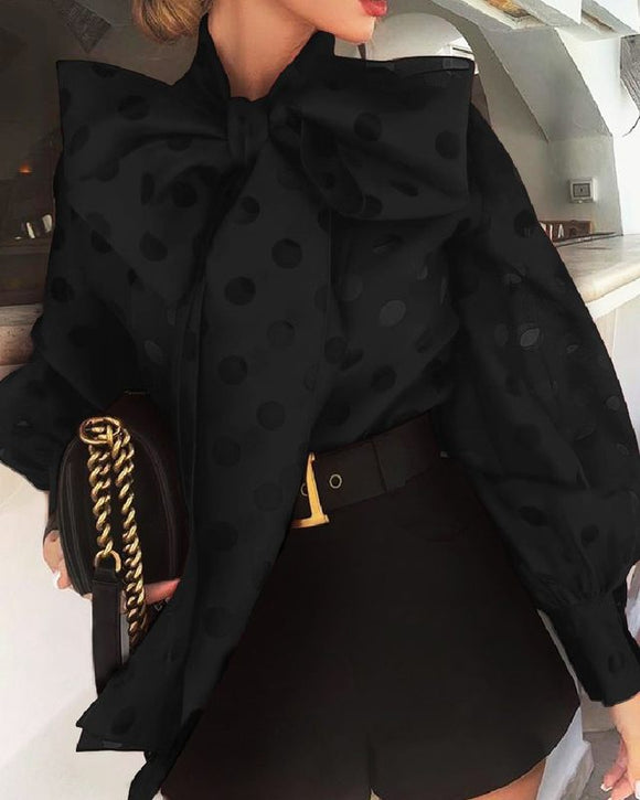 Blusa Elegante con Lunares Hueco y Moño Voluminoso en Mangas Linterna