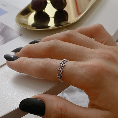 Anillo de Plata 925 Flor Hueca Ajustable con Diamante