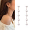 Aretes de Plata con Perlas Largas y Borla de Diseño Minimalista