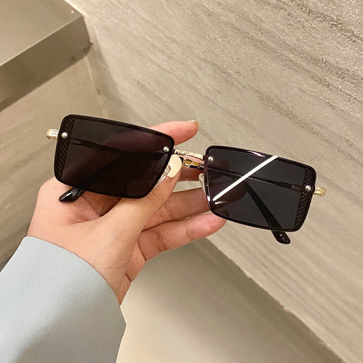 Retro small box red sunglasses with square resin lenses and gold-colored frames, held by a hand. - Image 3