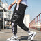 Pantalones Deportivos Holgados con Cordón y Múltiples Bolsillos