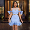 Vestido Elegante con Malla Transparente y Volantes Decorados