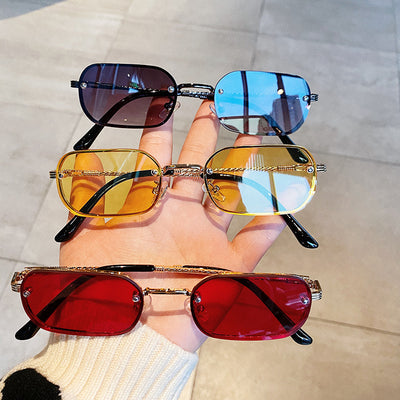 Trendy small frame square sunglasses with brown gradient lenses and gold-tone metal frames, held by a hand. - Image 11