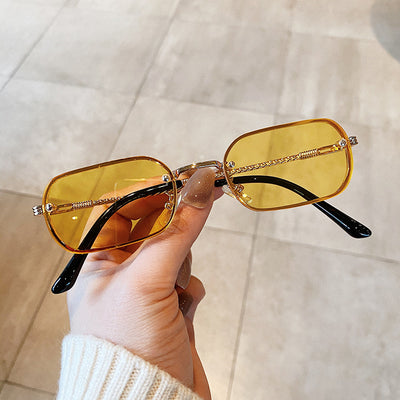 Trendy small frame square sunglasses with brown gradient lenses and gold-tone metal frames, held by a hand. - Image 9