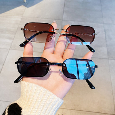 Trendy small frame square sunglasses with brown gradient lenses and gold-tone metal frames, held by a hand. - Image 12