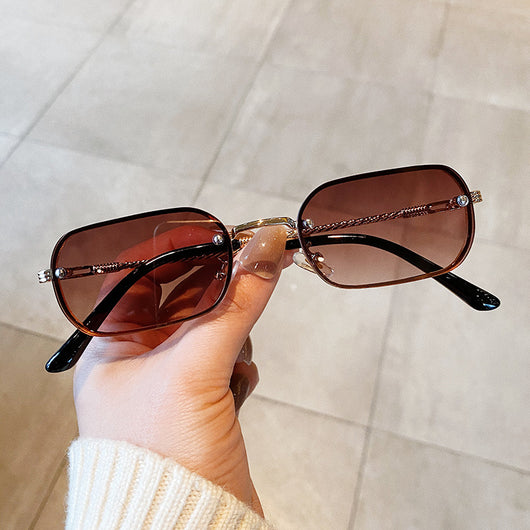 Trendy small frame square sunglasses with brown gradient lenses and gold-tone metal frames, held by a hand. - Image 4