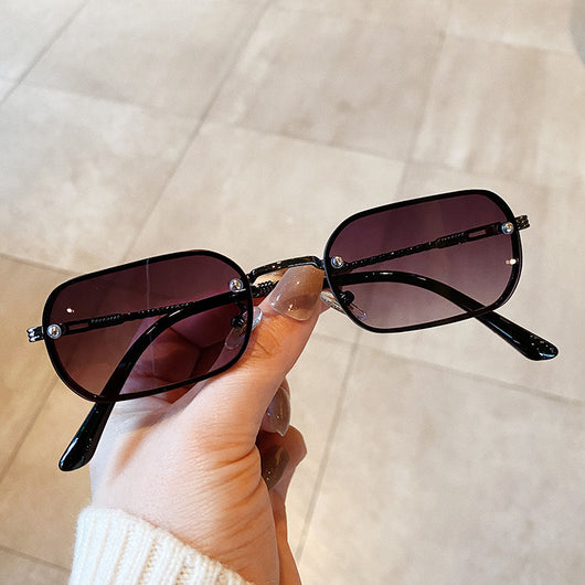 Trendy small frame square sunglasses with brown gradient lenses and gold-tone metal frames, held by a hand. - Image 3