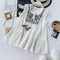 Blusa Vaquera Blanca con Bordado de Flecos y Detalles de Madera