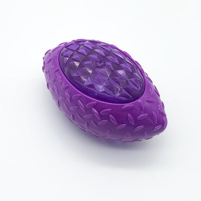 Green rubber pet toy shaped like a rugby ball with a translucent, faceted center for dogs. - Image 5