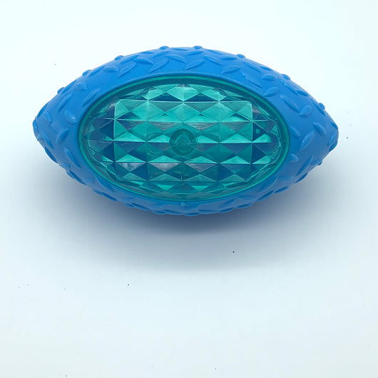 Green rubber pet toy shaped like a rugby ball with a translucent, faceted center for dogs. - Image 7