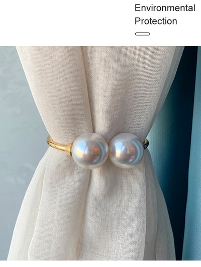 Gold alloy curtain tie-back with two large white faux pearls holding back a teal woven curtain. - Image 4