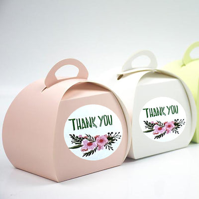 Roll of round 'Thank You' stickers with two floral designs: one dark with yellow flowers, one light blue with mixed flowers. - Image 2
