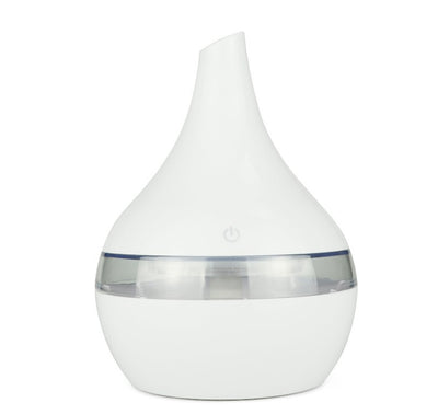 Light wood grain teardrop-shaped mini humidifier and aroma diffuser with a clear water tank and power button. - Image 14