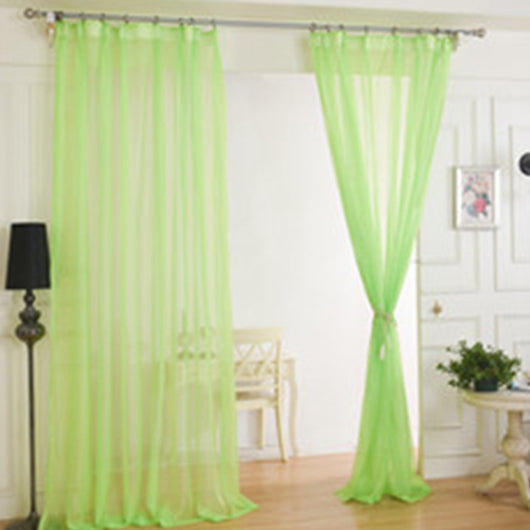 Light green sheer curtains hanging on a rod, one tied back, in a modern living room with white walls. - Image 10
