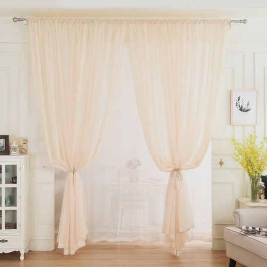 Light green sheer curtains hanging on a rod, one tied back, in a modern living room with white walls. - Image 7