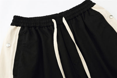 Pantalones Cortos con Costuras en Contraste y Puños Acampanados - Image 9