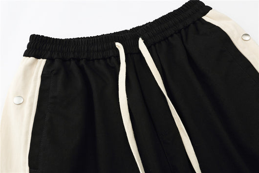 Pantalones Cortos con Costuras en Contraste y Puños Acampanados - Image 9