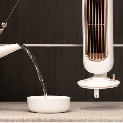 Pink small desktop electric fan humidifier with a rose gold grille and a sleek, modern design. - Image 5