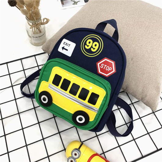 Green mini backpack for kids with a yellow school bus design on the front pocket, 'EXIT', '99', and 'STOP' patches. - Image 9