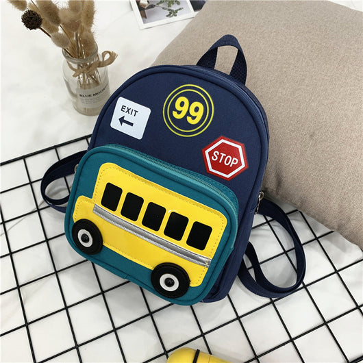 Green mini backpack for kids with a yellow school bus design on the front pocket, 'EXIT', '99', and 'STOP' patches. - Image 3