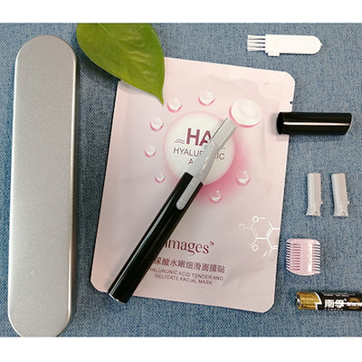 Pink electric shaver with cap off, showing blade, comb attachment, cleaning brush, and AA battery on a pink sheet mask. - Image 8