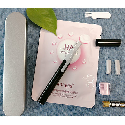 Pink electric shaver with cap off, showing blade, comb attachment, cleaning brush, and AA battery on a pink sheet mask. - Image 8