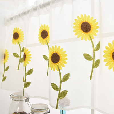 White sheer curtain with embroidered yellow sunflowers and green stems, hanging on a window rod. - Image 11