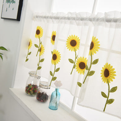 White sheer curtain with embroidered yellow sunflowers and green stems, hanging on a window rod. - Image 5