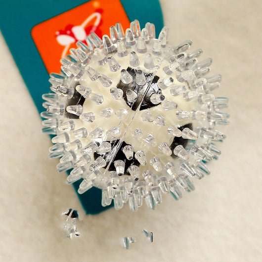 Clear spiky rubber ball with a bright yellow core, suitable for sensory play or as a pet toy. - Image 7