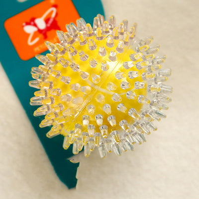 Clear spiky rubber ball with a bright yellow core, suitable for sensory play or as a pet toy. - Image 10
