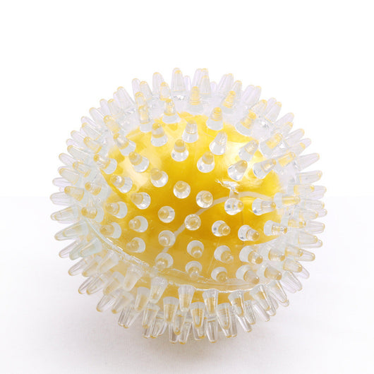 Clear spiky rubber ball with a bright yellow core, suitable for sensory play or as a pet toy.