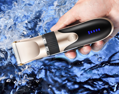 Gold and black electric hair clipper with an adjustable blade, held by a hand against a red background. Text indicates a free 17-piece set for the whole family. - Image 21