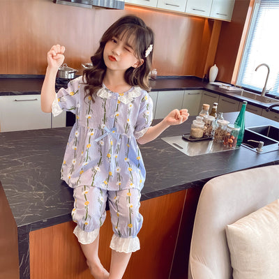 Light blue short-sleeved cotton pajamas for little girls, featuring a yellow and white floral print. - Image 7