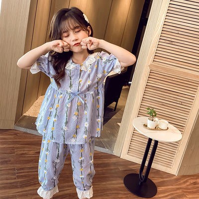 Light blue short-sleeved cotton pajamas for little girls, featuring a yellow and white floral print. - Image 6