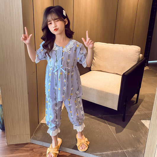 Light blue short-sleeved cotton pajamas for little girls, featuring a yellow and white floral print. - Image 9