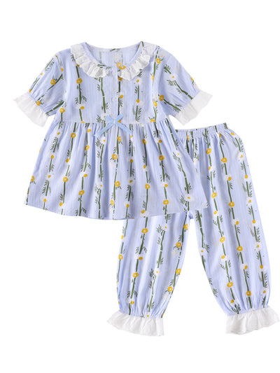 Light blue short-sleeved cotton pajamas for little girls, featuring a yellow and white floral print. - Image 5