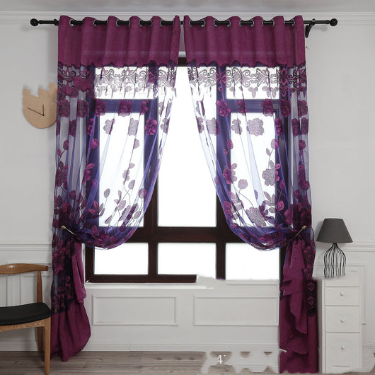 Light brown sheer window curtain with a floral jacquard burnt-out pattern, hung with grommets and styled with tie-backs.