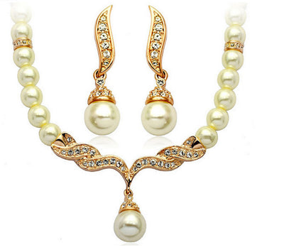 Elegant pearl necklace and matching drop earrings set with sparkling crystal accents, ideal for bridal wear. - Image 3