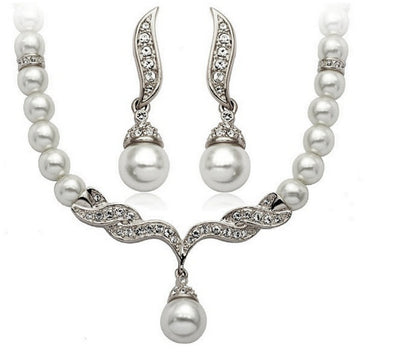 Elegant pearl necklace and matching drop earrings set with sparkling crystal accents, ideal for bridal wear. - Image 6