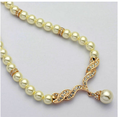 Elegant pearl necklace and matching drop earrings set with sparkling crystal accents, ideal for bridal wear. - Image 2